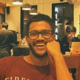 Mudit Sarda, smiling, in a café